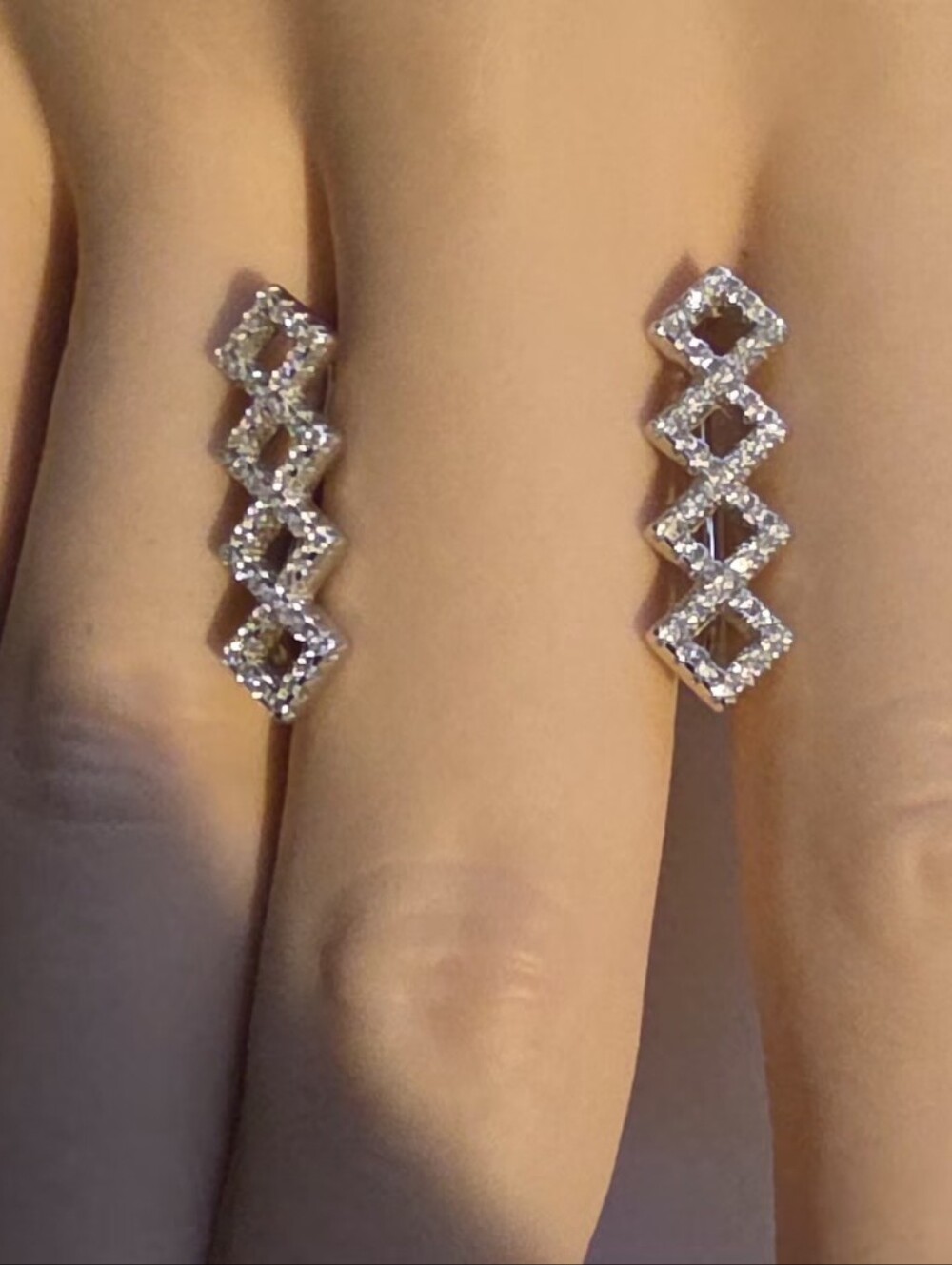 Elizabeth Jewelry Designs earrings crafted in 925 sterling silver with sparkling